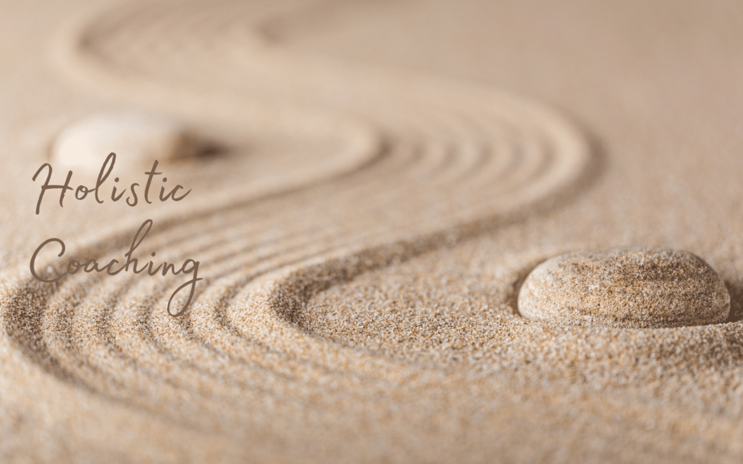 Relaxing photo with curves on sand writing Holistic Coaching